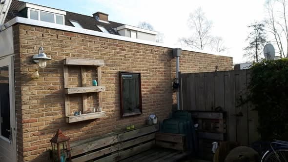 Zijgevel plat dak na complete renovatie en randafwerking in Heerjansdam